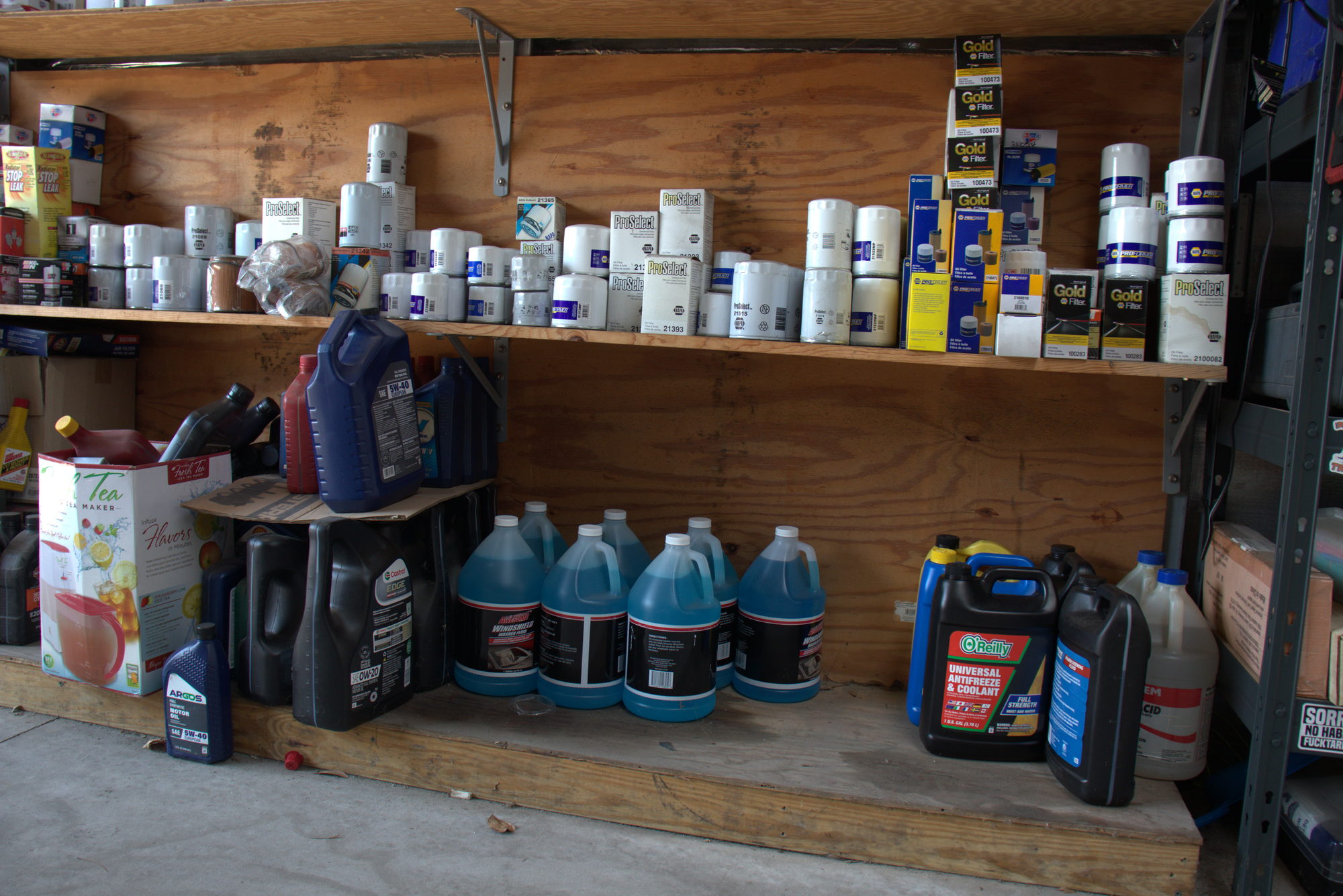 Shelf of motor oil and fluids at ANW Auto Care